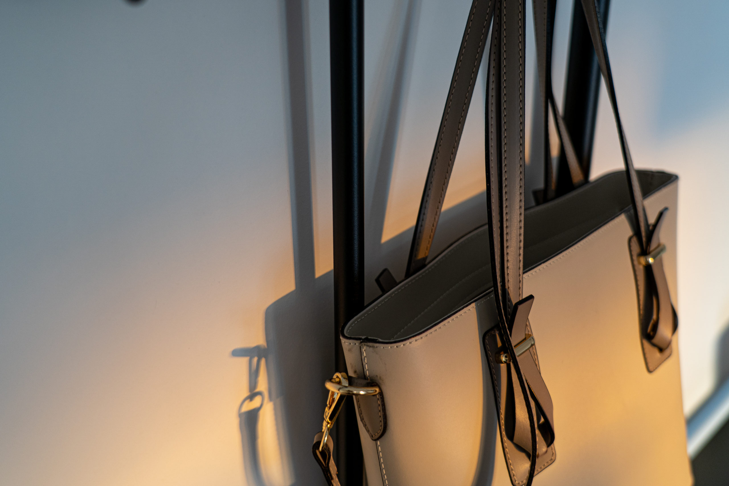 Canva - Close-up Photo of a Handbag Hanging on a Wall Canva Close up Photo of a Handbag Hanging on a Wall